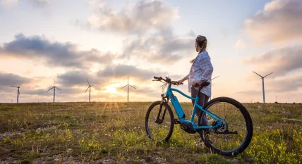 Woman with a bike in the nature