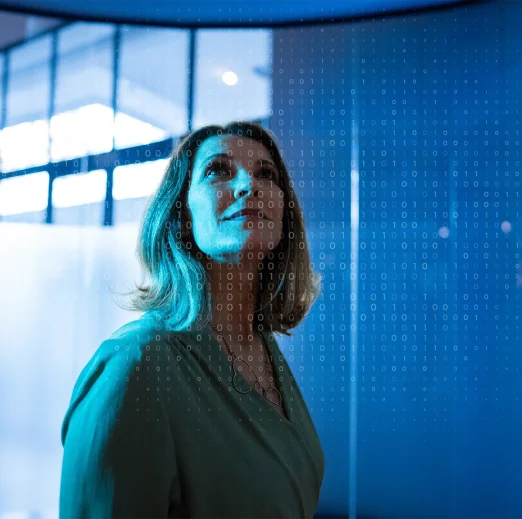 Mature businesswoman looking to a hologram at office