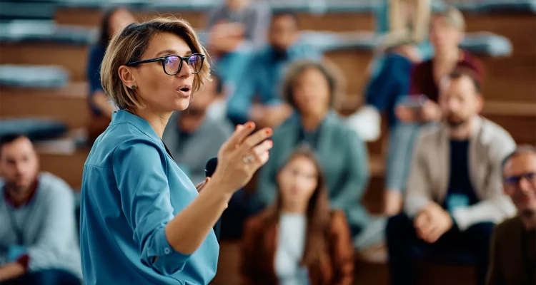 Female speaker giving a presentation during business seminar at convention center