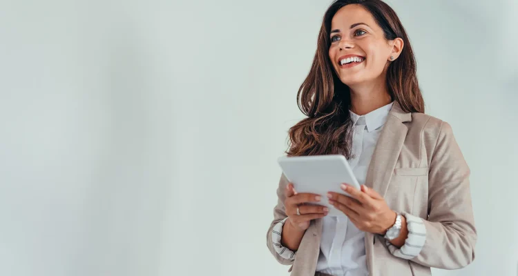 Business woman holding a tablet in a modern office setting