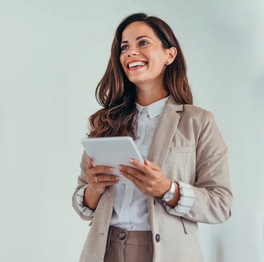 Business woman holding a tablet in a modern office setting