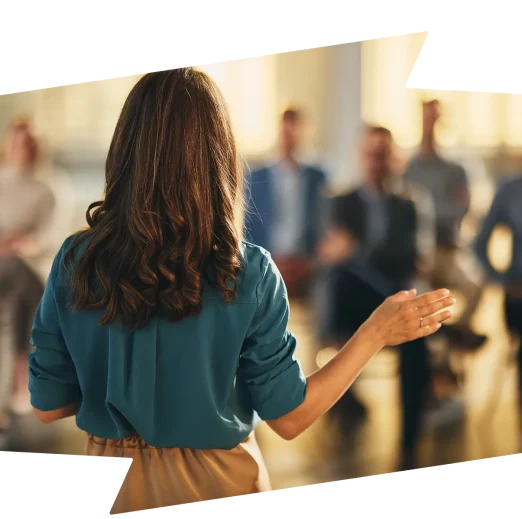 Back view of a businesswoman leading a seminar in board room